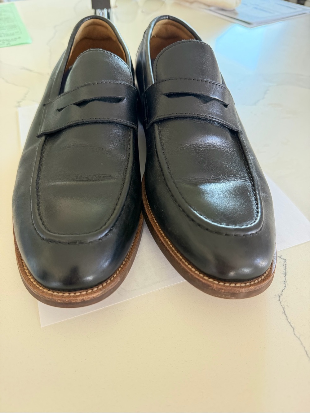 Florsheim Black Leather Penny Loafers with Brown Welt